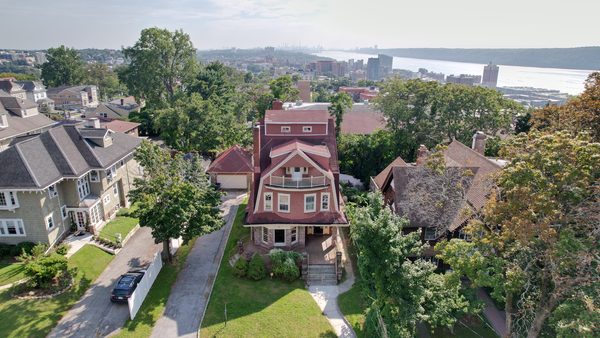 Aerial view of 10 Delavan Terrace with the Hudson River and the Manhattan skyline beyond