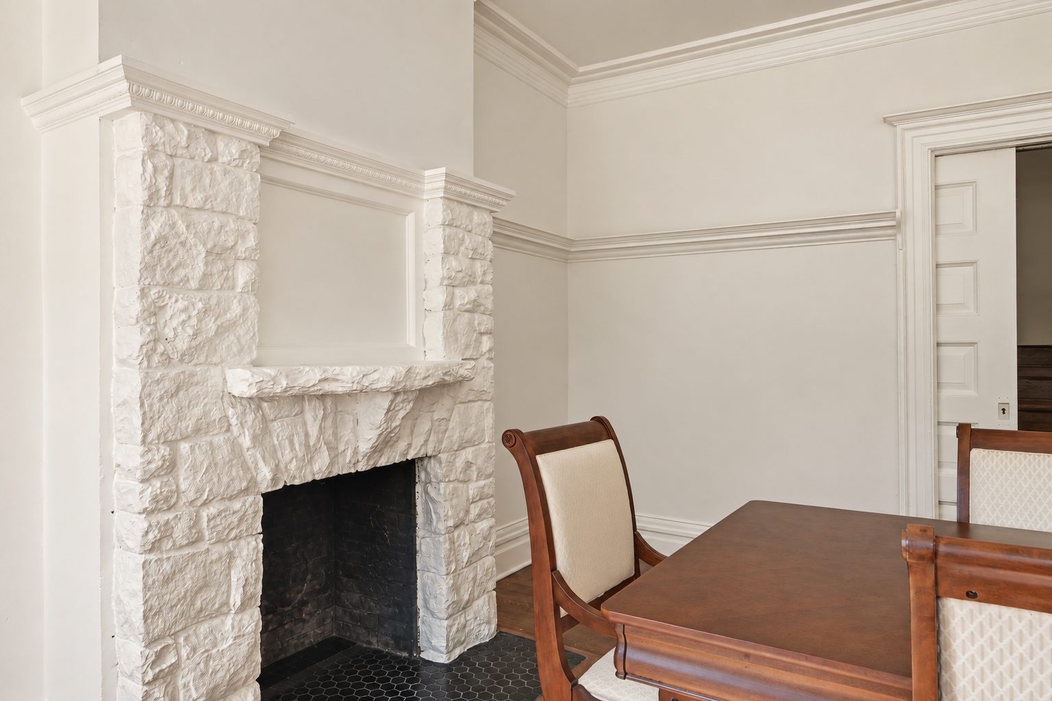 The dining room's stone fireplace
