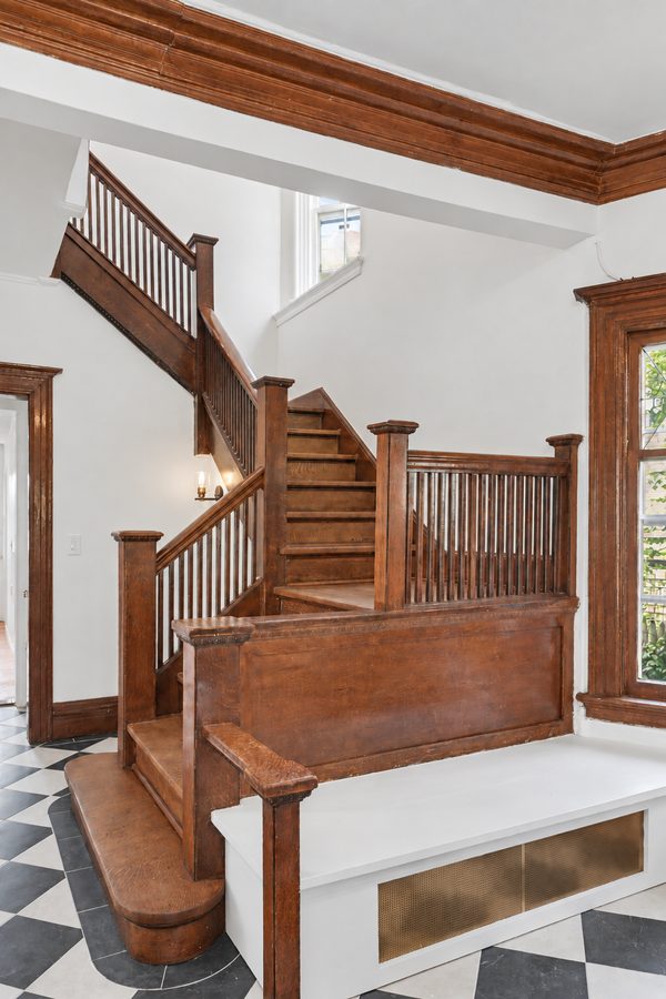 The staircase and the built-in seat at its foot