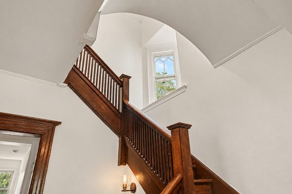 The staircase continuing to the upper floors