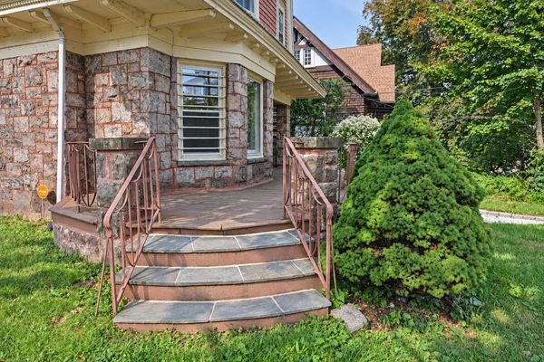 Stone steps rising to the front porch