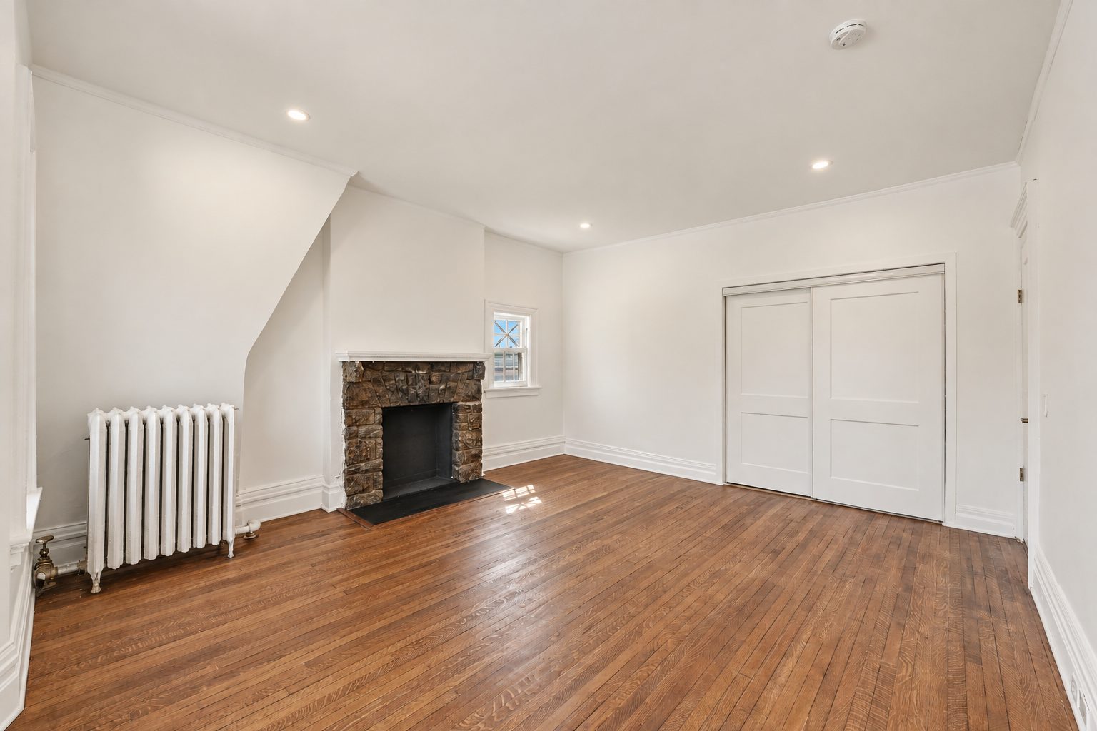 The second unit's living room with its fireplace